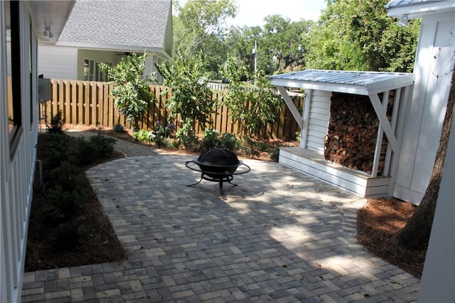 247 Circle Dr, Saint Simons Island, GA 31522 - view of patio featuring a fire pit