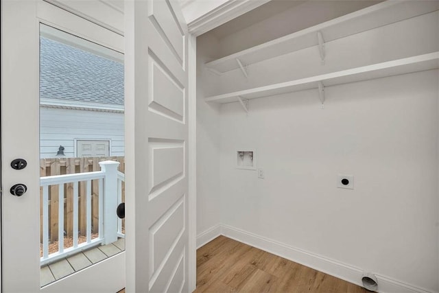 247 Circle Dr, Saint Simons Island, GA 31522 - laundry area with light wood-type flooring, hookup for an electric dryer, hookup for a washing machine, and baseboards