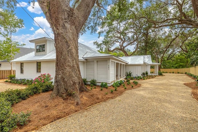247 Circle Dr, Saint Simons Island, GA 31522 - view of side of property with metal roof