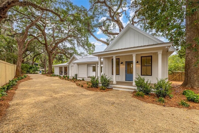 247 Circle Dr, Saint Simons Island, GA 31522 - modern farmhouse style home with board and batten siding, a porch, and driveway