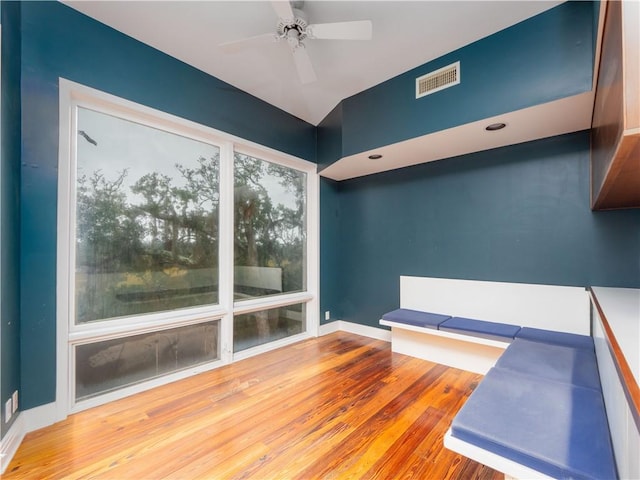 interior space with ceiling fan and hardwood / wood-style floors