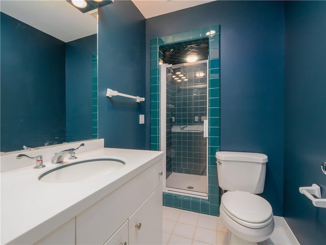 bathroom with vanity, an enclosed shower, and toilet