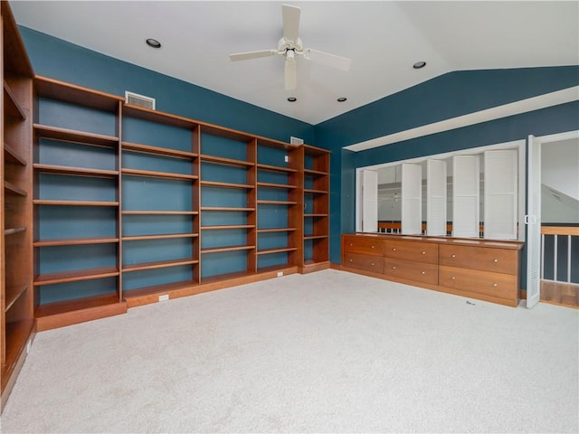 unfurnished bedroom featuring carpet flooring, ceiling fan, and lofted ceiling