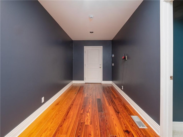 hallway featuring hardwood / wood-style floors