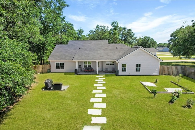 1317 Kyles Loop NE, Townsend, GA 31331 - back of house featuring a fenced backyard and a patio area