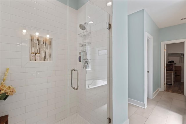 1317 Kyles Loop NE, Townsend, GA 31331 - full bath with a shower stall, tile patterned floors, and a walk in closet