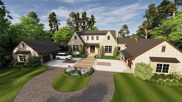 view of front of home featuring a front yard, a garage, stone siding, driveway, and an outdoor structure