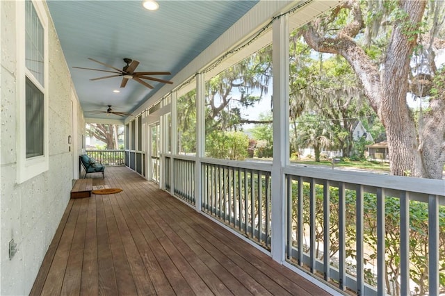 deck with a porch and ceiling fan