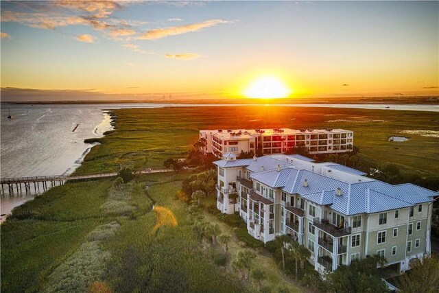 aerial view at dusk with a water view