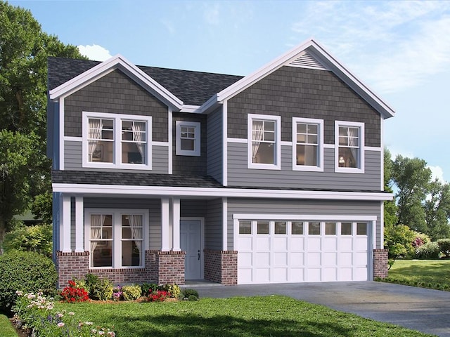 view of front facade featuring a front yard and a garage