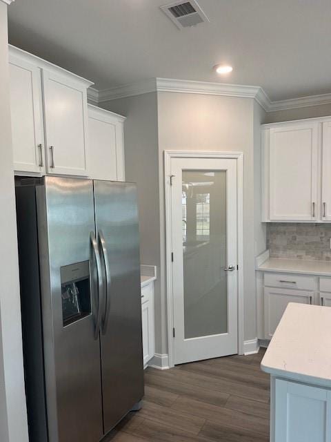 kitchen with white cabinets, stainless steel fridge with ice dispenser, and dark wood-type flooring