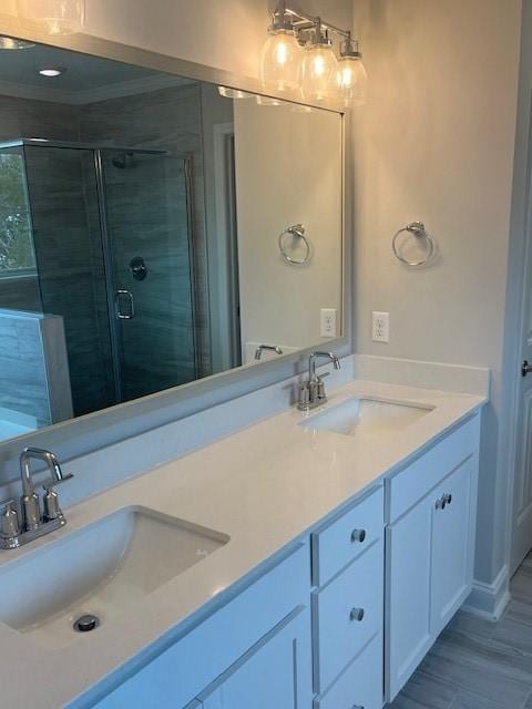 bathroom featuring vanity and an enclosed shower