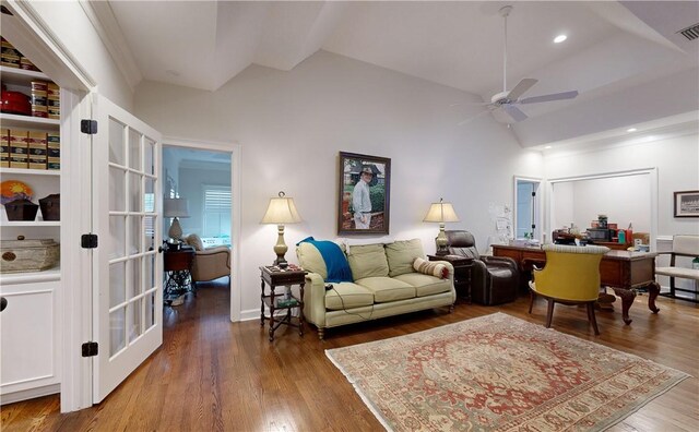 living room with ceiling fan, lofted ceiling, built in features, and dark hardwood / wood-style flooring