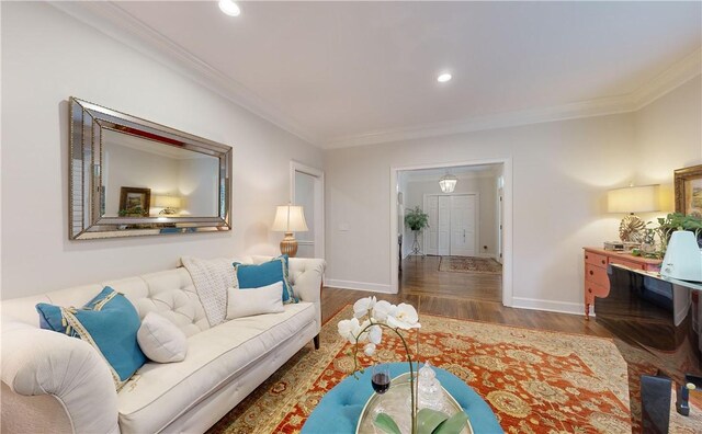 living room featuring ornamental molding and dark hardwood / wood-style floors