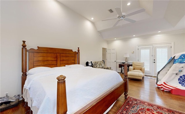 bedroom featuring french doors, dark wood-type flooring, vaulted ceiling, access to outside, and ceiling fan
