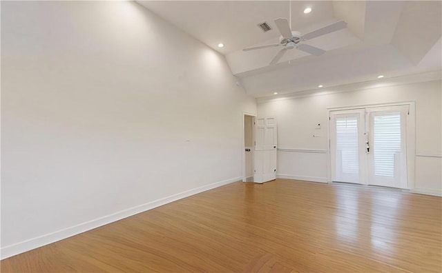 empty room with french doors, ceiling fan, and light hardwood / wood-style flooring
