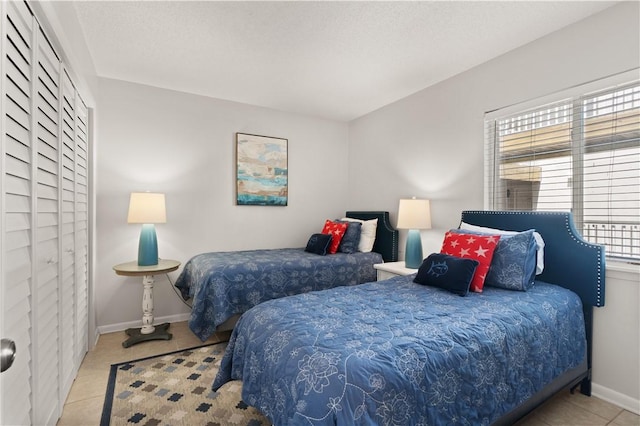 bedroom with light tile patterned floors