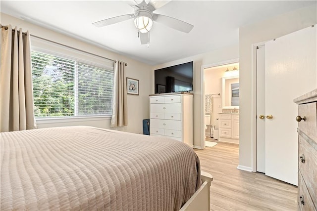 850 Mallery St Unit 3M, Saint Simons Island, GA 31522 - bedroom with light wood-type flooring, a ceiling fan, and ensuite bath