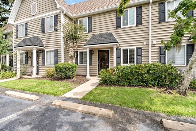 850 Mallery St Unit 3M, Saint Simons Island, GA 31522 - multi unit property featuring uncovered parking, roof with shingles, and a front yard
