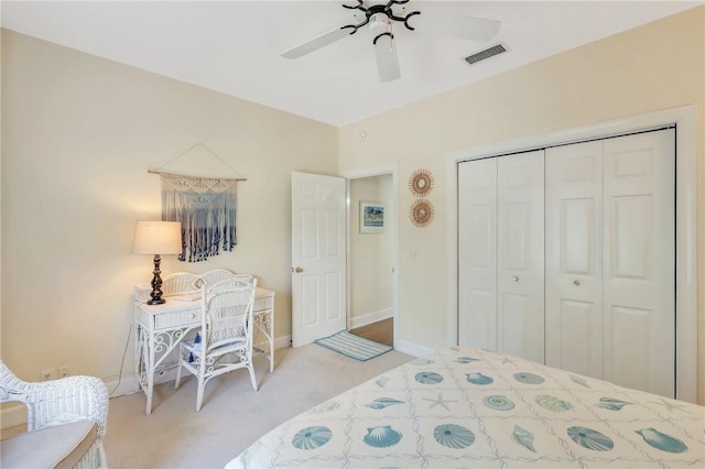 bedroom with baseboards, visible vents, ceiling fan, carpet, and a closet