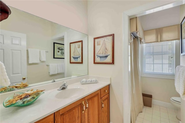 full bath featuring tile patterned flooring, baseboards, vanity, and toilet