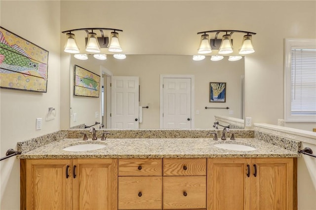 bathroom featuring a sink and double vanity