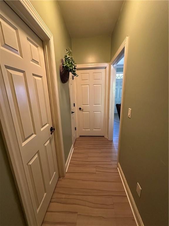 116 Bartram Trl, Blackshear, GA 31516 - hallway with light wood-type flooring and baseboards