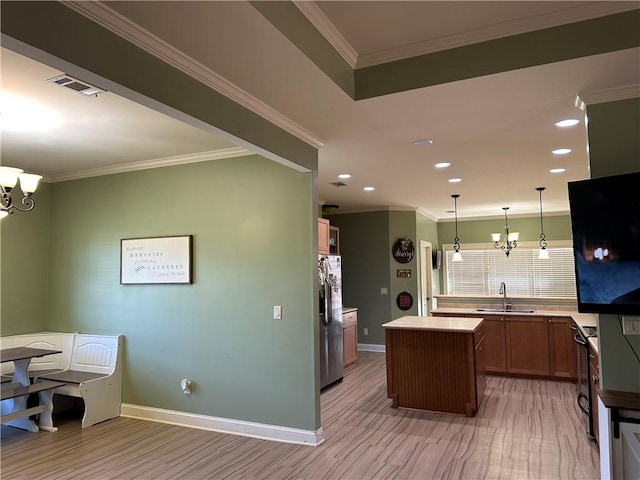 116 Bartram Trl, Blackshear, GA 31516 - kitchen with stainless steel refrigerator with ice dispenser, a sink, a center island, light wood-style floors, and baseboards