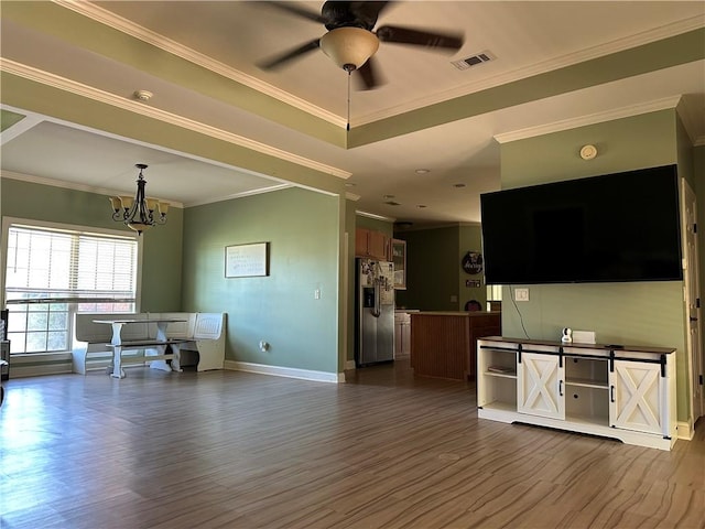 116 Bartram Trl, Blackshear, GA 31516 - living area featuring dark wood-style floors, a chandelier, ceiling fan, baseboards, and ornamental molding