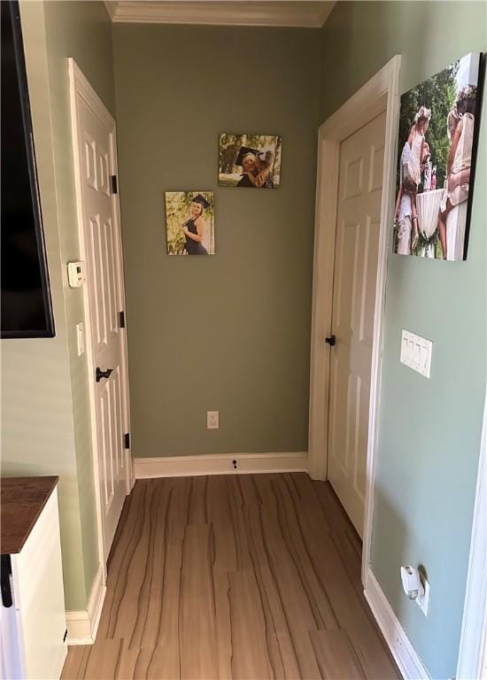 116 Bartram Trl, Blackshear, GA 31516 - hallway featuring baseboards, wood finished floors, and ornamental molding