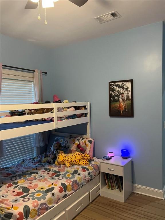 116 Bartram Trl, Blackshear, GA 31516 - bedroom featuring wood finished floors, baseboards, and a ceiling fan