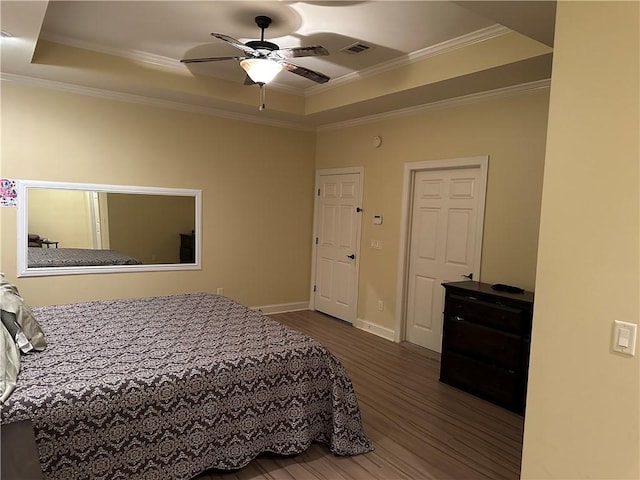 116 Bartram Trl, Blackshear, GA 31516 - bedroom with a raised ceiling, wood finished floors, crown molding, baseboards, and a ceiling fan