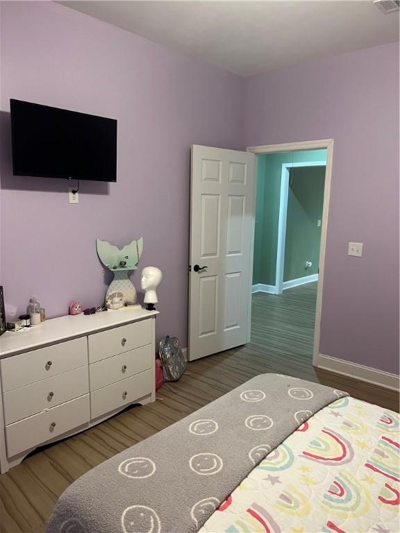 116 Bartram Trl, Blackshear, GA 31516 - bedroom with light wood finished floors and baseboards