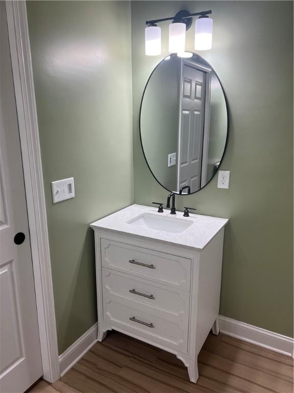 116 Bartram Trl, Blackshear, GA 31516 - bathroom featuring baseboards, wood finished floors, and vanity