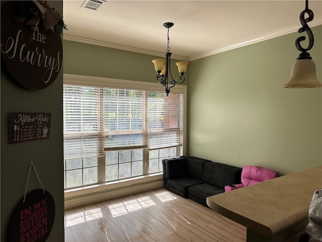 116 Bartram Trl, Blackshear, GA 31516 - sitting room with a chandelier, crown molding, and wood finished floors