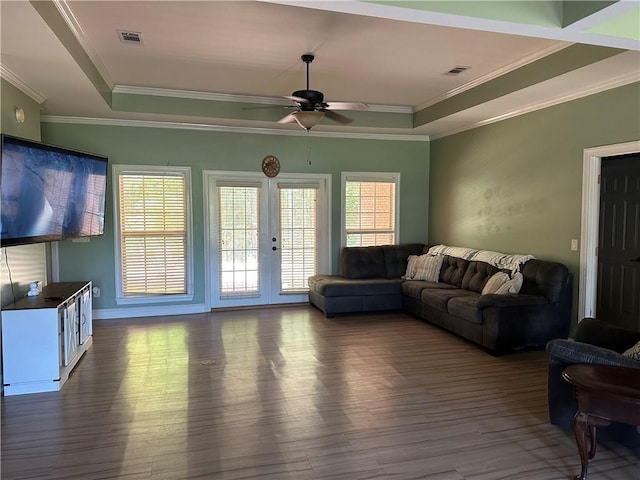 116 Bartram Trl, Blackshear, GA 31516 - living area featuring a raised ceiling, wood finished floors, ceiling fan, and crown molding