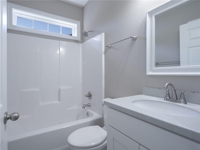 full bathroom featuring vanity, shower / washtub combination, and toilet