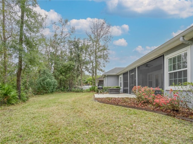 view of yard featuring a patio area and a sunroom