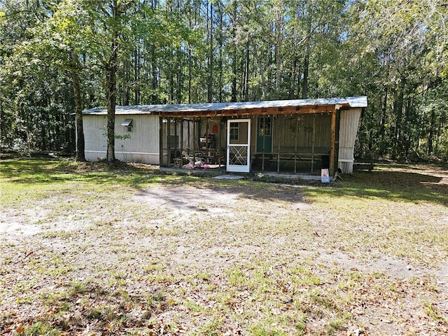 exterior space with an outbuilding and a yard