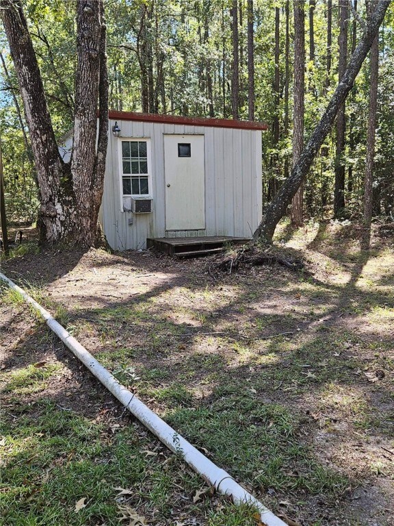 view of outbuilding featuring cooling unit