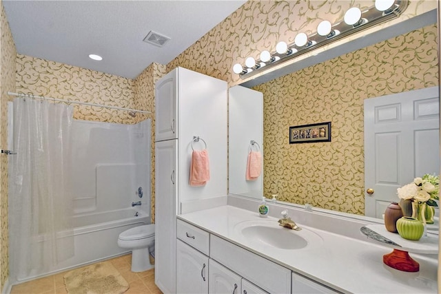 full bathroom featuring vanity, toilet, shower / bath combo, tile patterned floors, and a textured ceiling