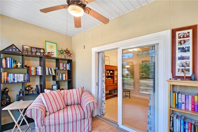 sitting room with light tile patterned floors and ceiling fan