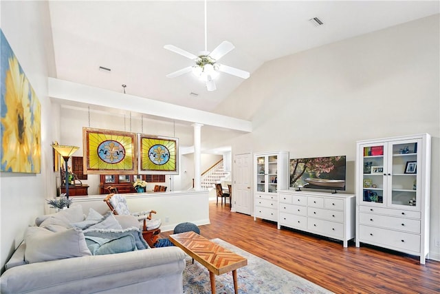 living room featuring high vaulted ceiling, dark hardwood / wood-style floors, and ceiling fan