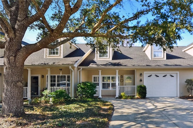 view of front facade with a garage and covered porch