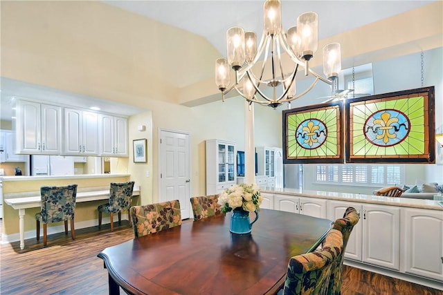 dining room featuring dark hardwood / wood-style floors and a chandelier