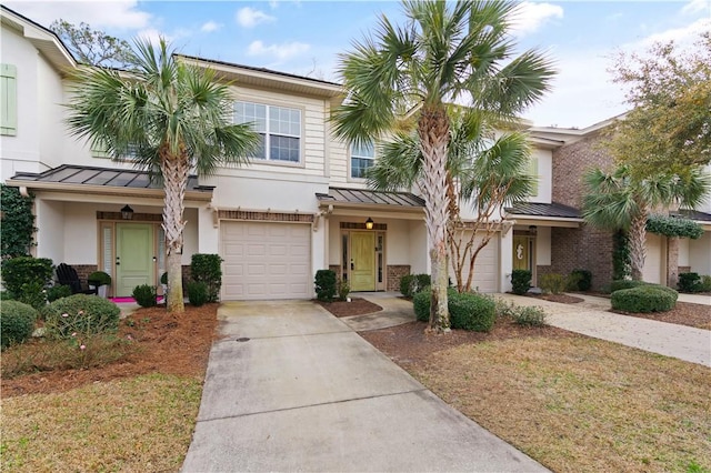 1407 Reserve Ct, Saint Simons Island, GA 31522 - townhome / multi-family property featuring a garage