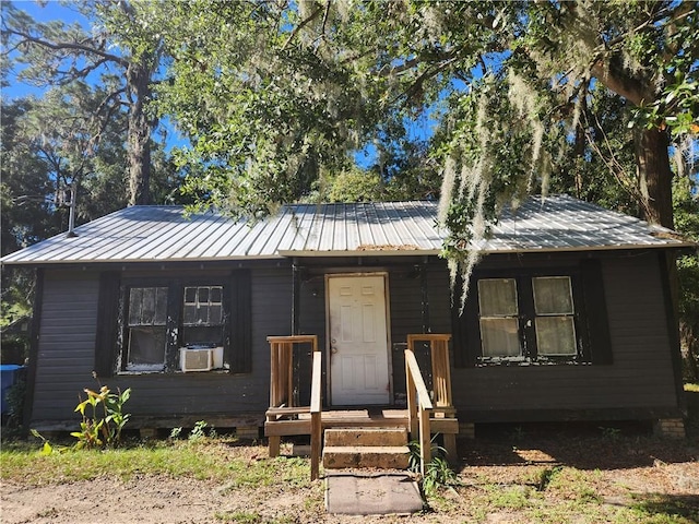 view of front of house featuring cooling unit