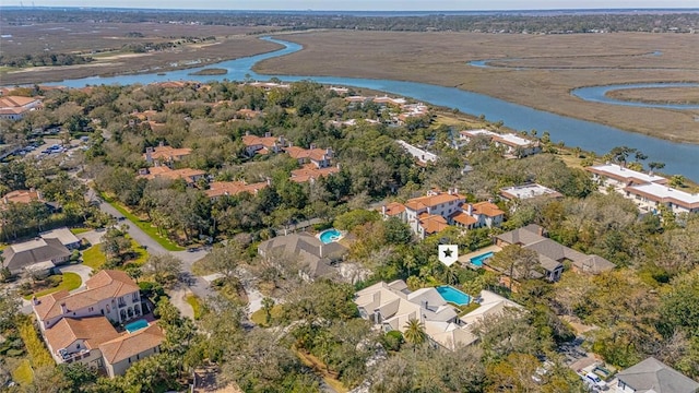 drone / aerial view with a water view and a residential view