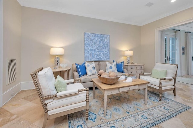 living area featuring baseboards, visible vents, and crown molding