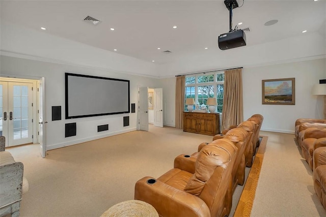 home theater featuring a tray ceiling, french doors, recessed lighting, visible vents, and baseboards